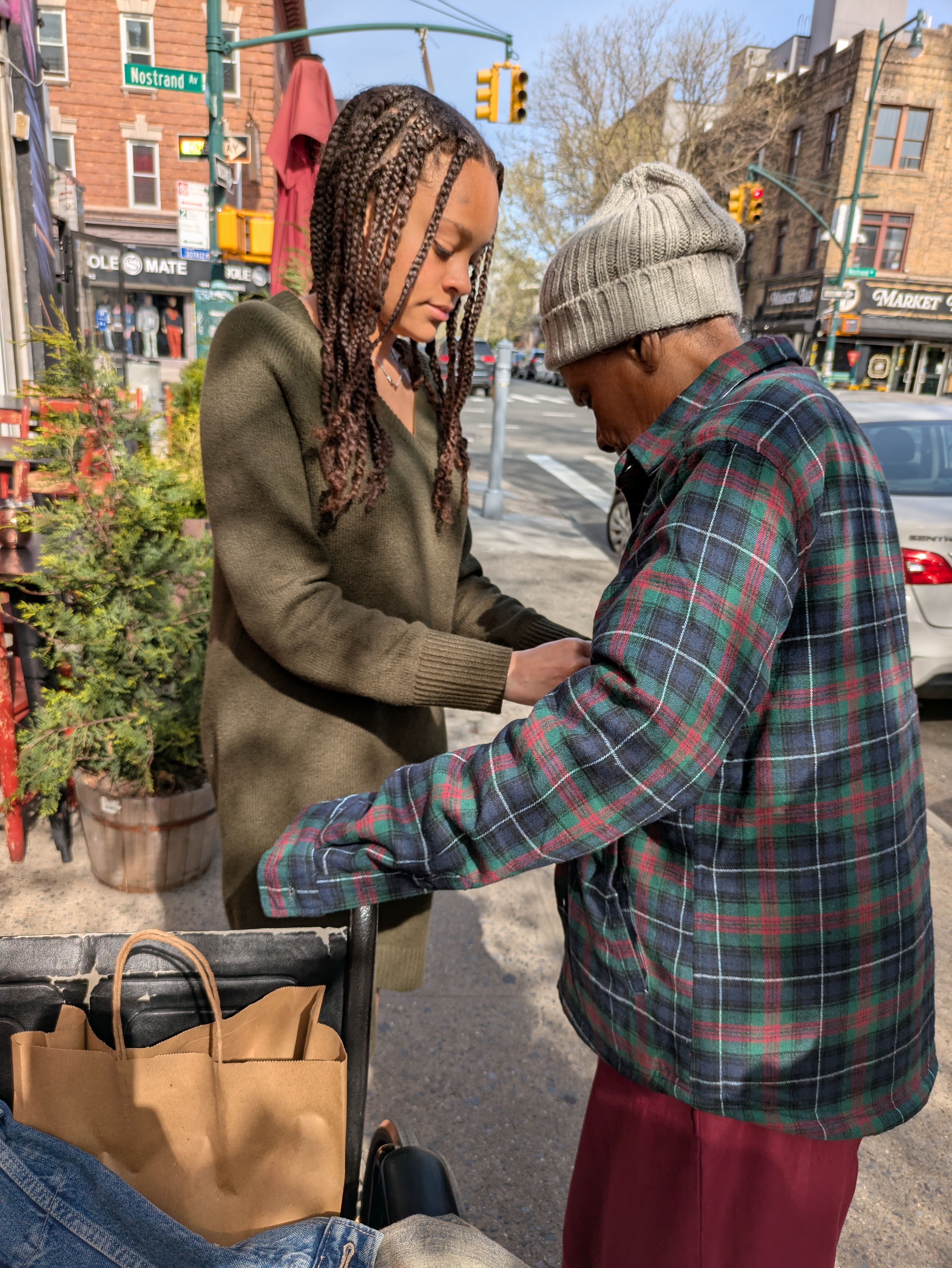 Jay's wife helping his grandmothers
