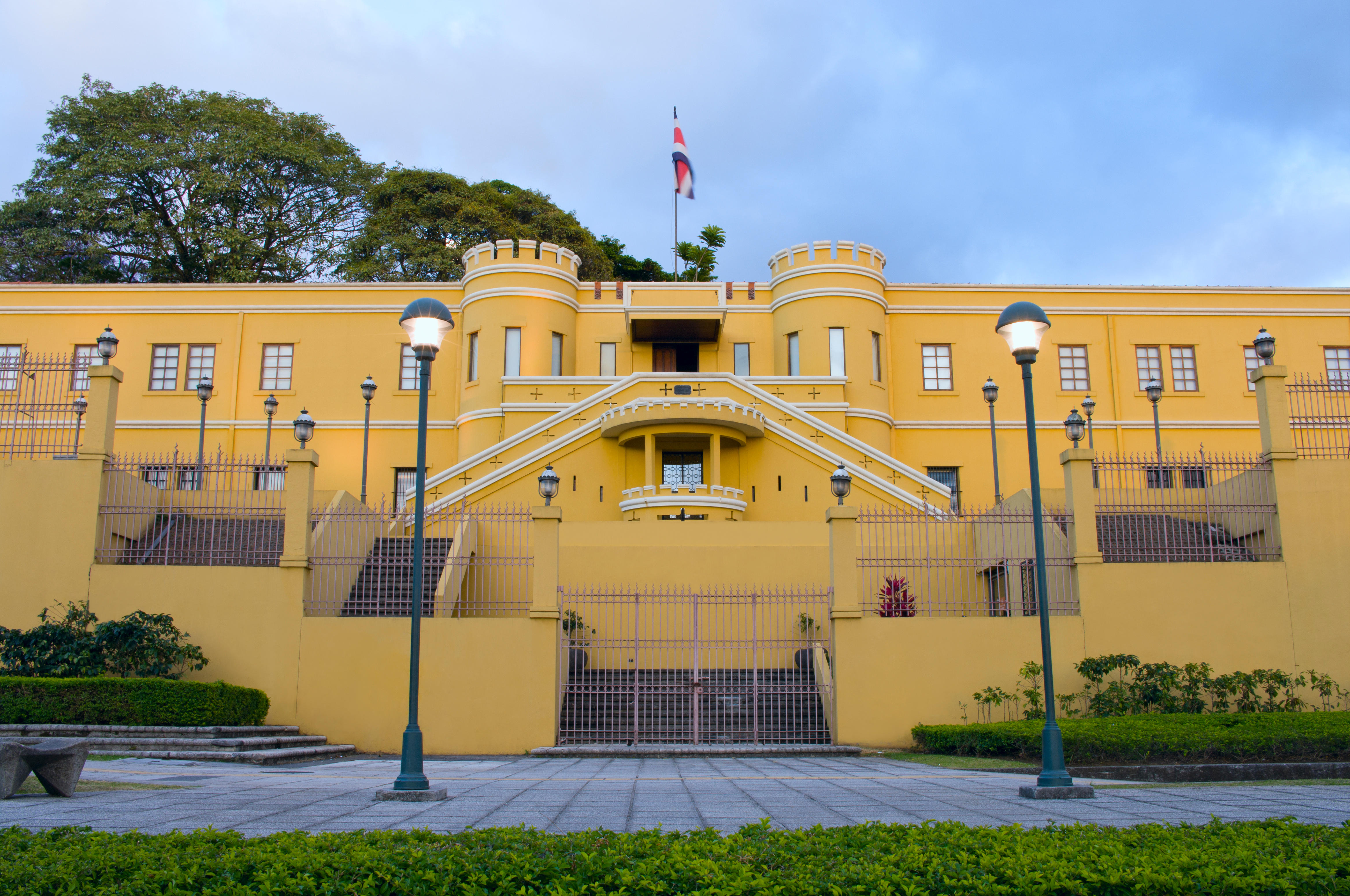 Two Businesswomen Using Laptop Computer In Office Meeting