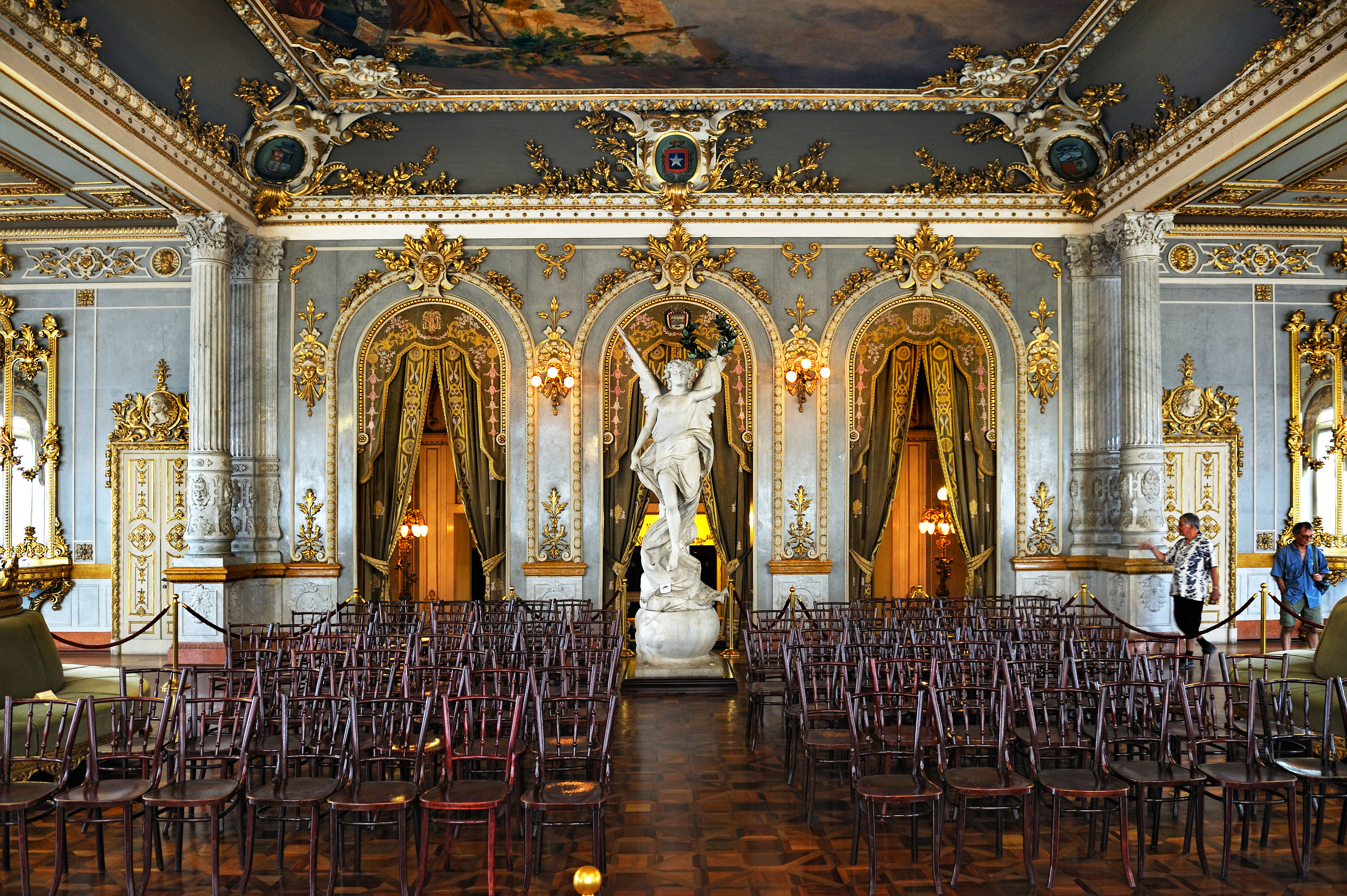 Close up of a smiling female entrepreneur. Businesswoman sitting at her desk working on laptop.