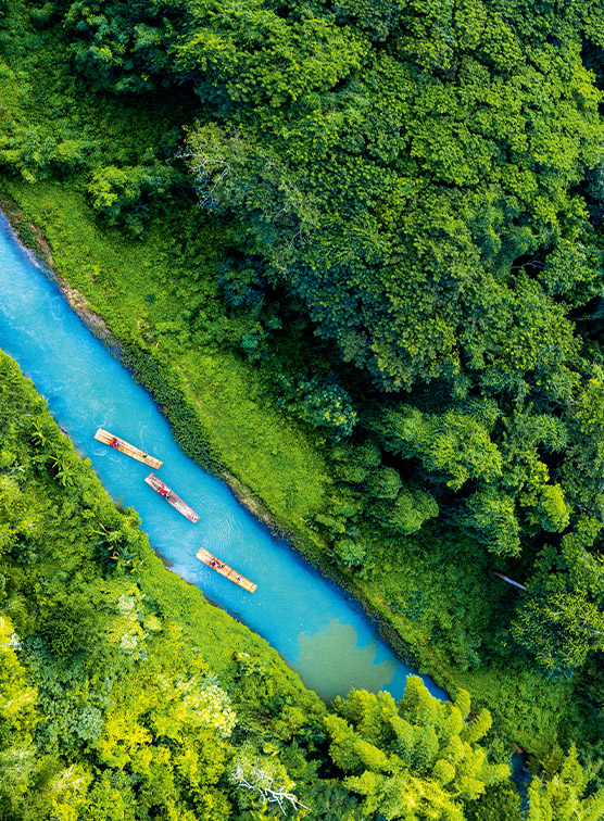 Ariel view of a river in Jamaica with canoes