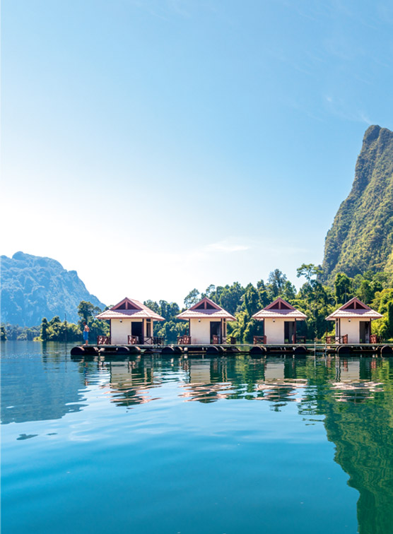 Cabins over calm sea in Thailand. 