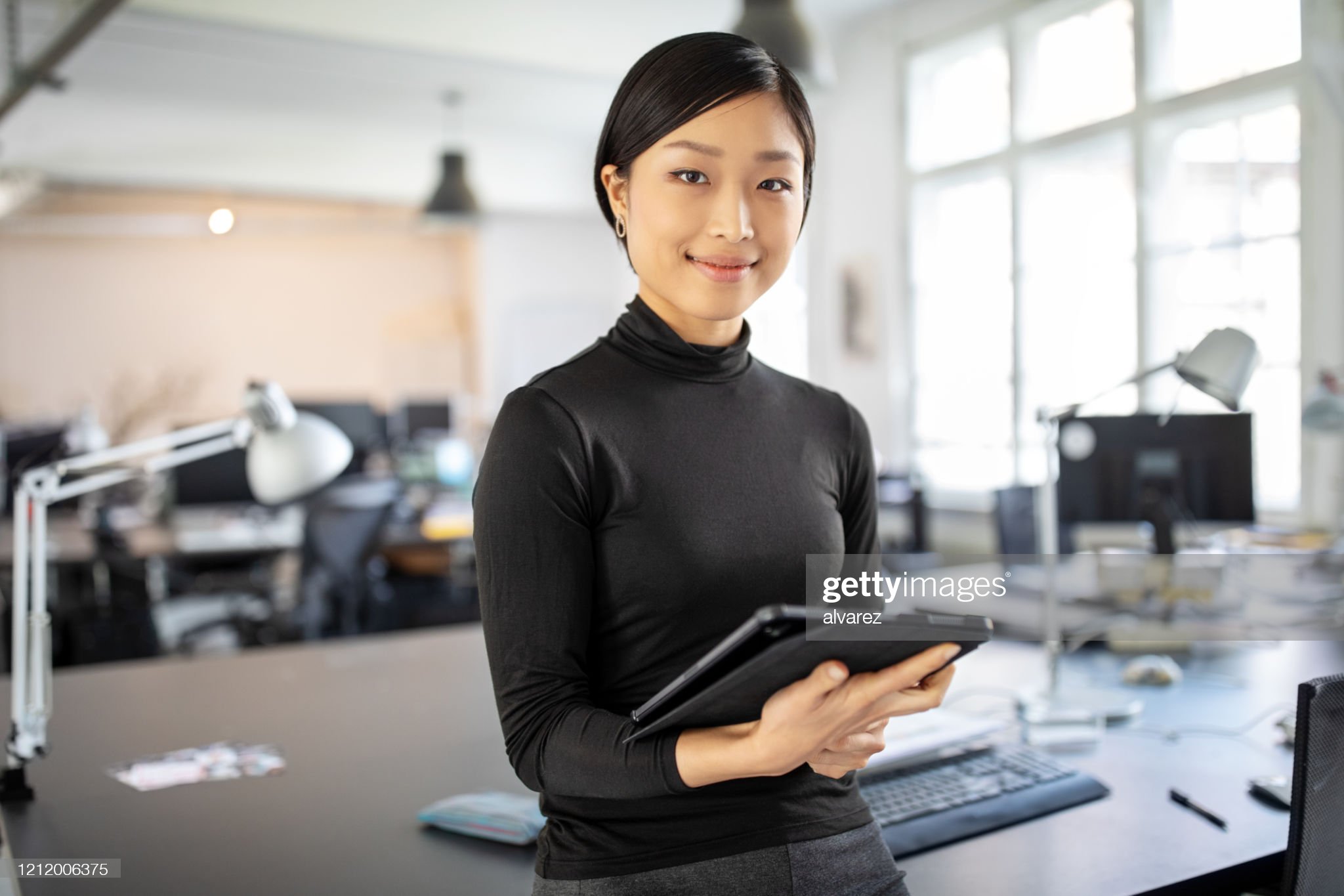 Close up headshot portrait of smiling young Caucasian businessman in glasses posing in office. Profile picture of happy millennial male employee or worker in eyewear at workplace. Employment concept.