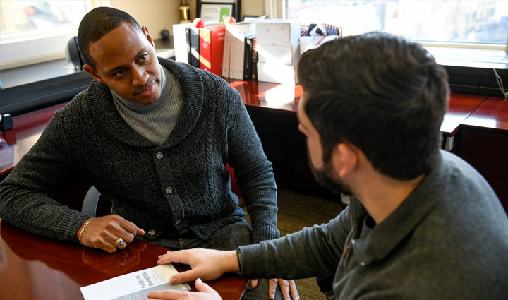Wounded warrior Tyshawn Jenkins reviews resume with WWP Warriors to Work teammate. 