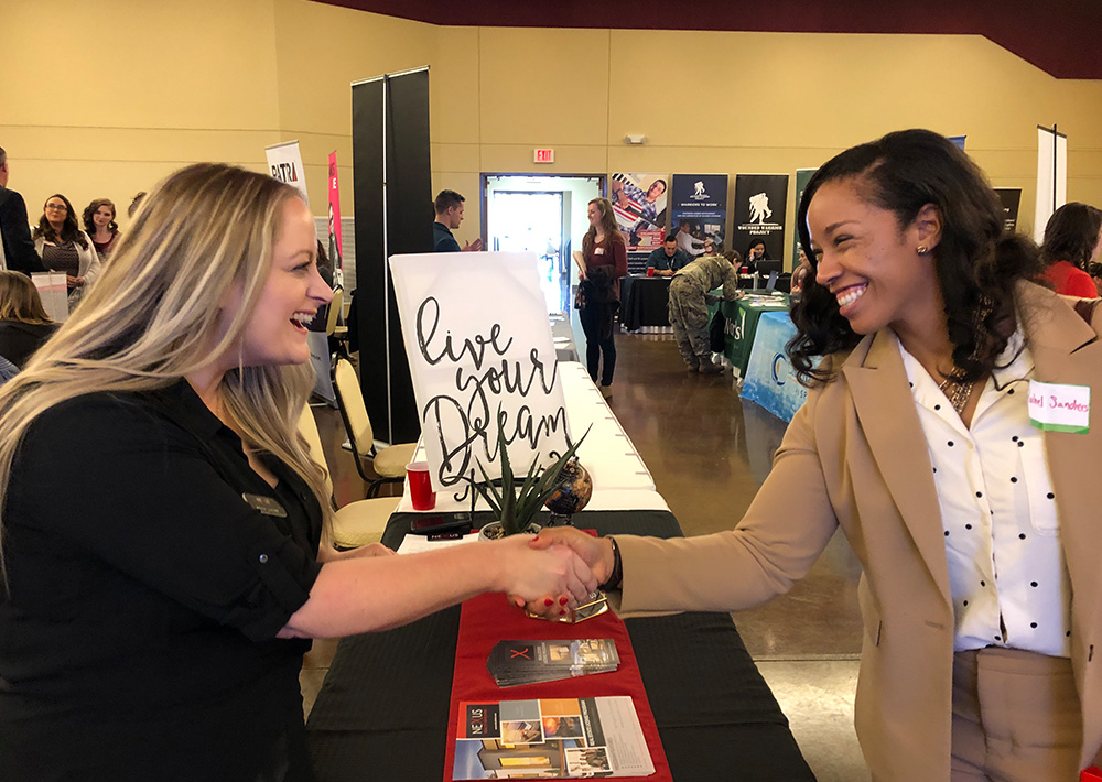 Wounded warrior meets with potential employer. 