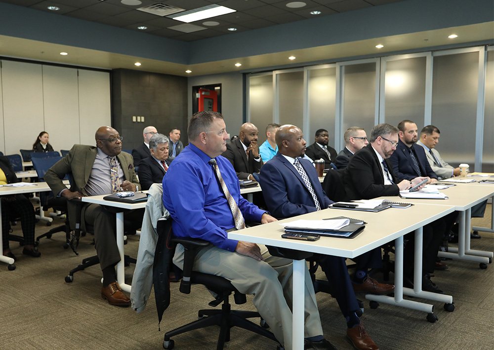 Wounded warriors listen to presentations from potential employers.